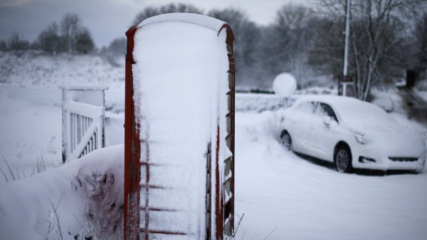 An abandoned car and telephone box near Ashbourne in the English Midlands.