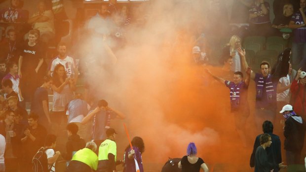 Revolt: Perth Glory fans set off flares during their loss to the Sky Blues.