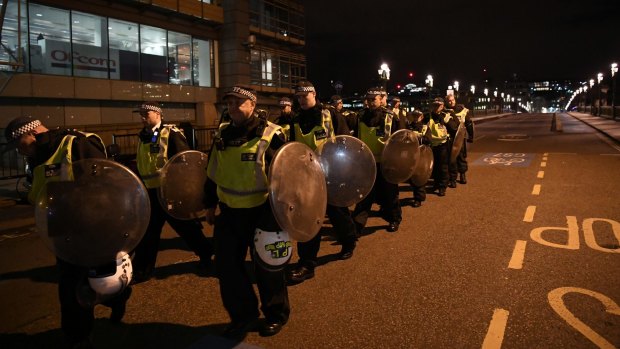 Police walk over Southwark Bridge after an attack in the centre of London.