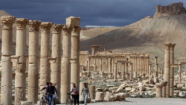 Syrian citizens in the ancient oasis city of Palmyra.