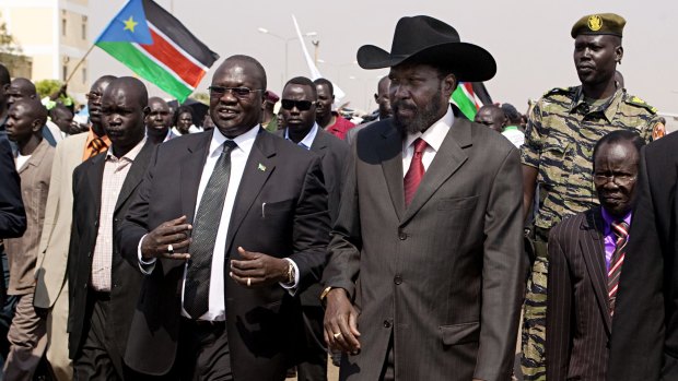 South Sudanese President Salva Kiir, centre-right, greeted by then vice-president Riek Machar, centre-left, in Juba in 2011.
