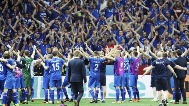Wave of success: Iceland players celebrate after defeating England.