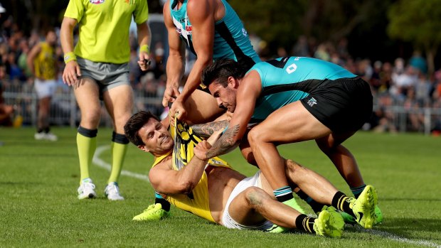 Seeing double: Yellow-clad impires were hard to distinguish from Richmond players on the weekend