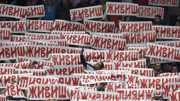 Crvena Zvezda (Red Star) Belgrade supporters hold banners, reading "You live" in the memory of a supporter killed in Istanbul last November.