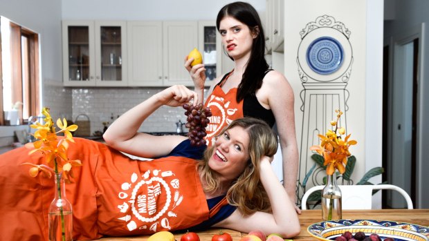 Comedians Kate McLennan (on table) and Kate McCartney are behind the social media sensation, <i>The Katering Show</i>.
