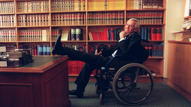 Acting Judge Donald Stewart at work after losing his feet  to gangrene.