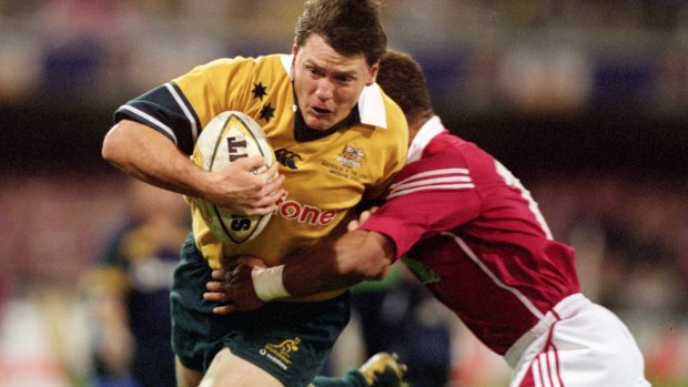 Notorious match: Matt Burke takes on the Lions at the Gabba in 2001.