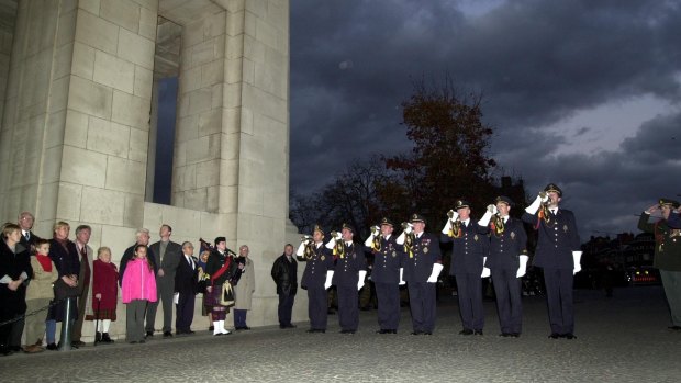 Bugle players from the Last Post Association sound off the 25,000th  Last Post  at the Menin Gate in Ieper, Belgium, Wednesday, Oct. 31, 2001.   The gate contains the names of some 50,000 Commonwealth soldiers who fell in World War I and whose remains have never been found. 