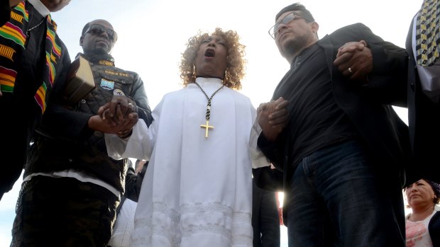 Dr Jeannetta Million of Victorious Believers Church leads a group of local pastors in a brief prayer vigil in San Bernardino.