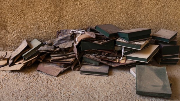 Empty boxes from manuscripts burned by Islamist rebels in Timbuktu. Abdel Kader Haidara organized the evacuation of about 300,000 manuscripts before the fighters invaded.