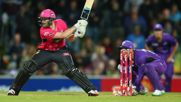Rik 'n' roll: Sixers recruit Riki Wessels switch-hits during his side's victory over the Hurricanes in Hobart.