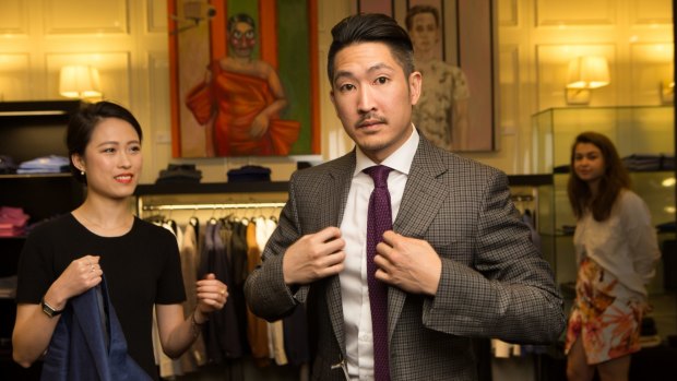 Here's looking at you ... Nam Nguyen tries on a Tom Ford jacket with Wendy Jiang at Harrolds, Melbourne. 