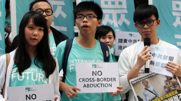 Members of the pro-democracy group Demosisto including Joshua Wong (centre)  protest in June against the "disappearance" of the Hong Kong booksellers.