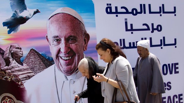 A billboard welcomes Pope Francis at St Mark's Cathedral in Cairo, Egypt.