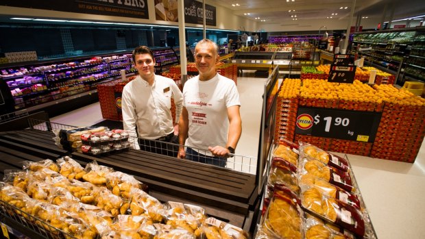 Store manager Damian Pennyfield, left, and Autolyse's Mickey Gubas at the new Coles store opening at Wanniassa Shopping Centre. 
