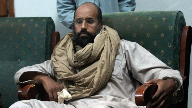 Saif al-Islam Gaddafi, the second son of Libya's dictator, after his capture in November 2011. He predicted civil war if his father's regime was removed.