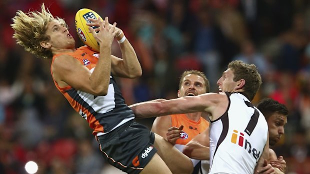 High flyer: Nick Haynes takes a mark for GWS against Hawthorn.