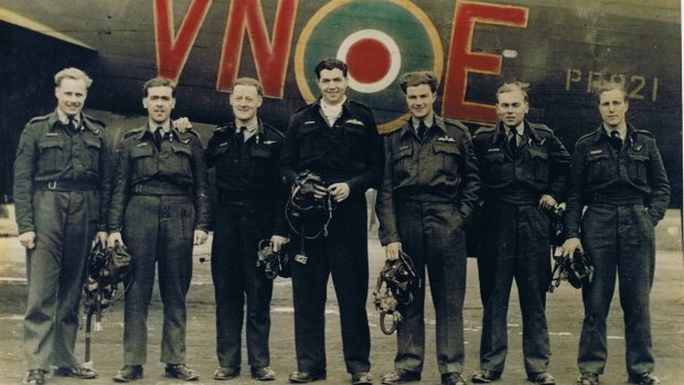 Cyril Nethery (centre) in front of Lancaster in RAAF uniform together with wireless operator to his right.
