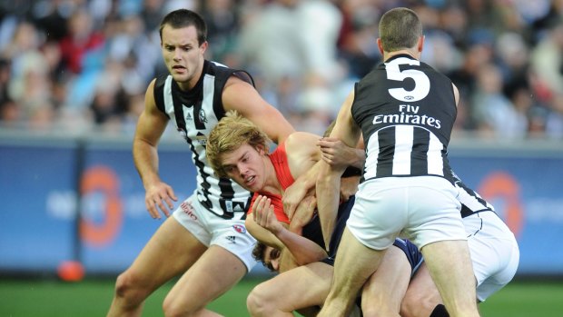 Magpie mauling: Jack Watts is crunched in that first tackle on his Melbourne debut in 2009.