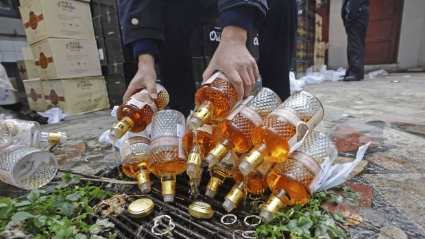 Bottles of confiscated fake whisky seized in Wuhan, China, in 2012. 