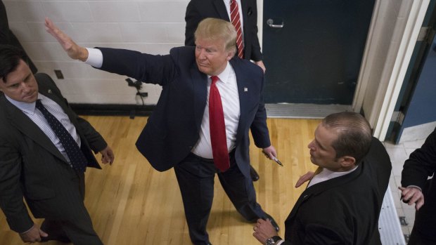 Republican presidential candidate Donald Trump waves to attendees as he leaves a campaign stop on Monday.