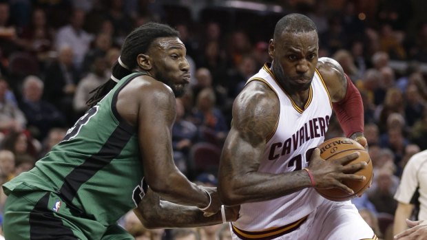 Closely guarded: Cleveland Cavaliers forward LeBron James drives past Boston Celtics rival Jae Crowder.