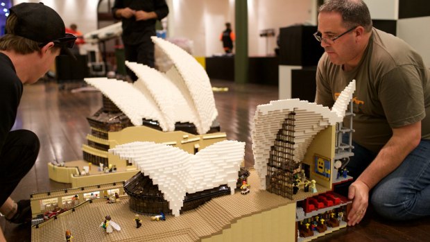 Ryan McNaught (right) and workers set up for the Lego exhibition at Sydney's Town Hall.