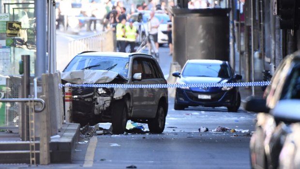 A damaged vehicle at the scene of the incident on Flinders Street, in Melbourne, Thursday, December 21.