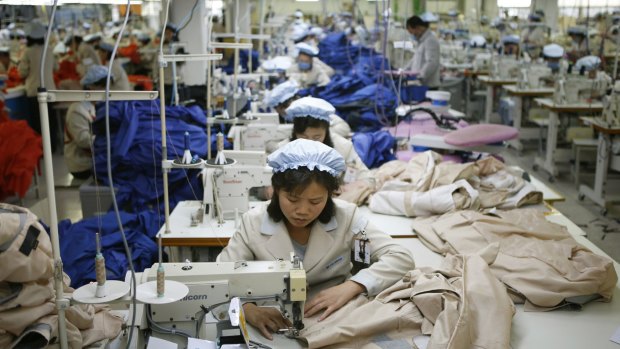 North Korean workers assemble jackets at a factory of a South Korean-owned company at the jointly-run Kaesong Industrial Complex, in Kaesong, North Korea. 