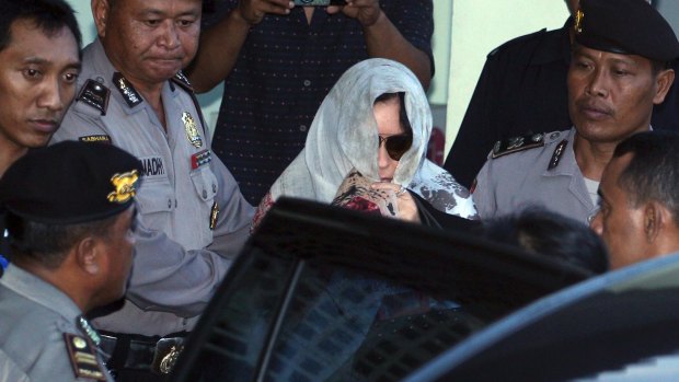Schapelle Corby covered her head with a scarf ias she left the parole office in Bali on Saturday. 