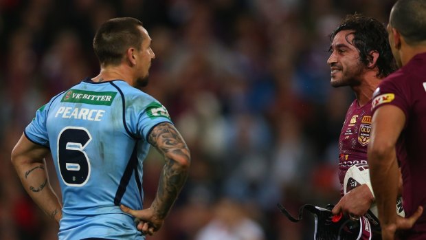 Sledge: Mitchell Pearce and Johnathan Thurston exchange words in 2015.