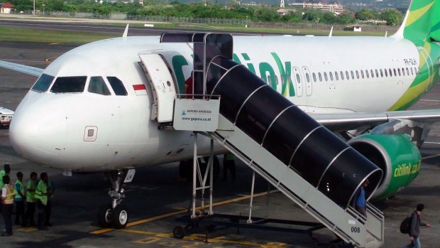 A flight attendant aboard a Citilink plane noticed the man change the clothes in the lavatory.

