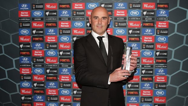 Melbourne Victory coach Kevin Muscat poses with the A-League Coach of the Year Award on Monday night.