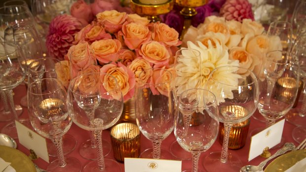 Wine glasses and floral arrangement on a table setting for the White House banquet for Chinese President Xi Jinping.