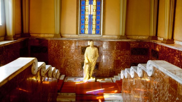 Reverence: Stalin's statue under a stained glass window.
