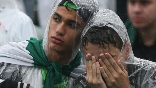 Grief-stricken: Fans at a Chapecoense memorial service.