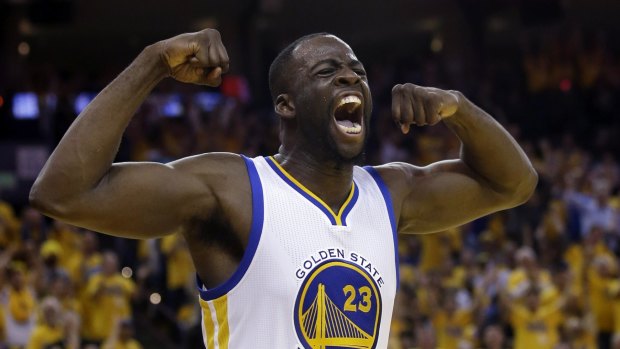 Muscling up: Golden State Warriors forward Draymond Green  celebrates after scoring in game five.