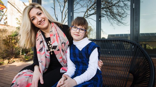 Michelle Cooper relies on before-school care for her daughter Macy.
