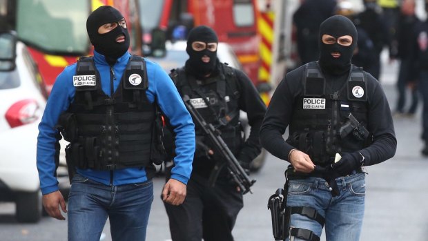 Police during the Saint Denis operation on the outskirts of Paris.