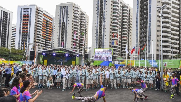 Team Australia is welcomed to the athletes' village at the start of the Olympics.