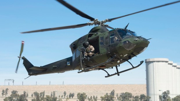 A Canadian Forces Griffon helicopter comes in for a landing near the Mosul dam in February.