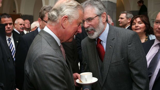 Historic: Britain's Prince Charles, Prince of Wales (L) shakes hands with Irish Republican party Sinn Fein leader, Gerry Adams on Tuesday.