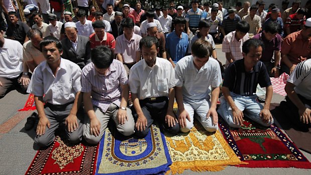 Uighur men pray in a mosque in Urumqi, the capital of western China's Xinjiang province. 