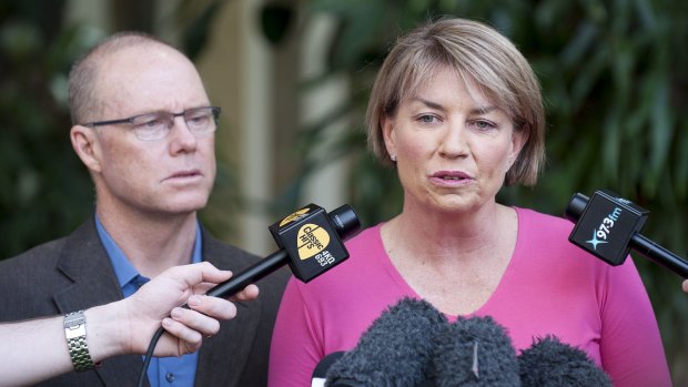 Anna Bligh stands with then husband, Greg Withers, as she resigns from her seat in south Brisbane in  March 2012.