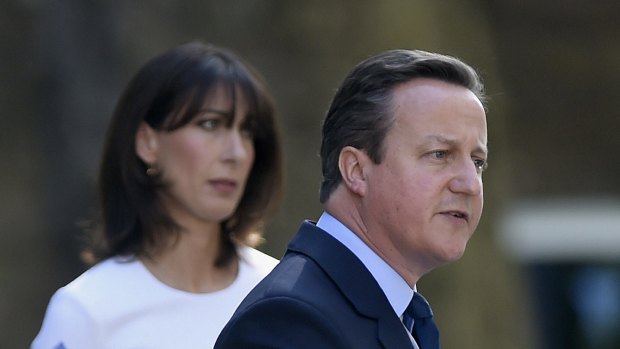 Britain's Prime Minister David Cameron announces his resignation following the Brexit vote as his wife Samantha looks on. 