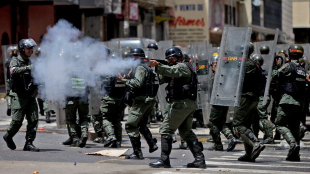 Bolivarian National Guards fire rubber bullets at people protesting for food. Some 19 journalists covering the protests were reportedly attacked.