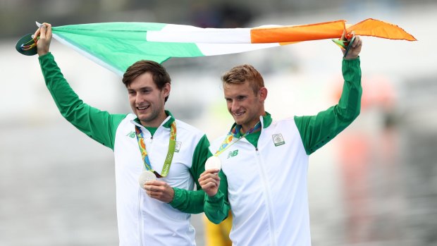 Silver medalists Paul O'Donovan, left, and brother Gary celebrate.