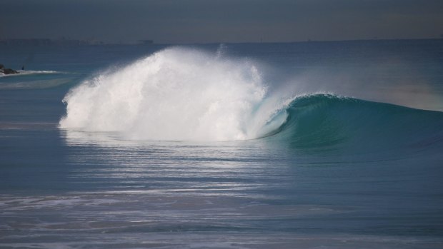 A nice wave breaks "unsurfed" off City Beach on Friday morning.