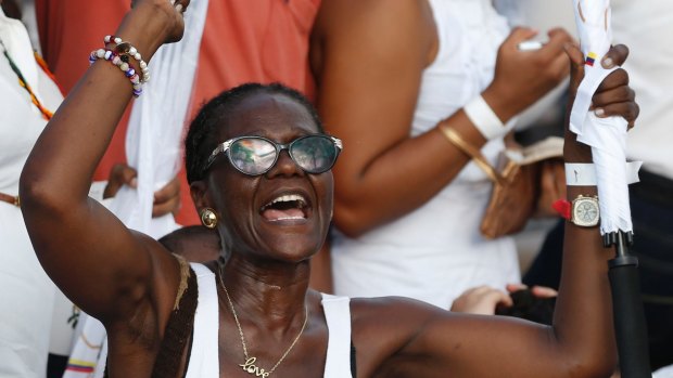 A woman shouts slogans in support of the peace agreement in Cartagena, Colombia, on Monday.