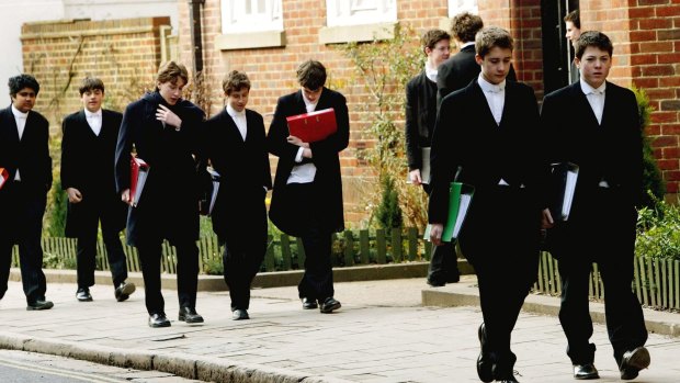 Tailcoats and starched collars: Pupils at Eton College, England hurry between lessons in 2004.